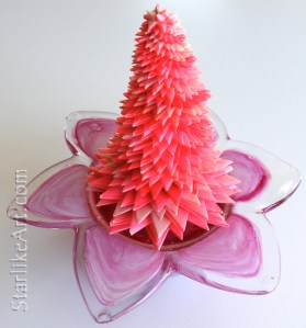 Leo Jean's Starlike© paper sculpture atop glass flower