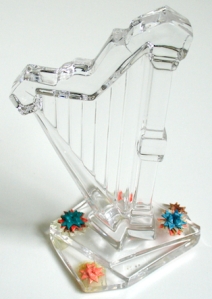 Leo Jean's Starlike© tiny paper sculptures at base of crystal harp.