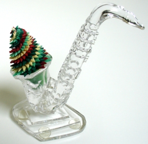 Leo Jean's Starlike© paper sculpture atop a crystal saxophone