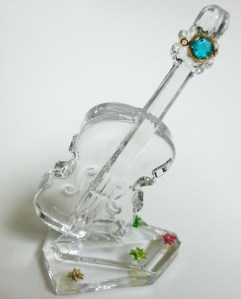 Leo Jean's Starlike© paper sculpture atop a crystal guitar