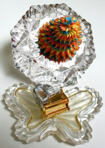 Leo Jean's Starlike© paper sculpture atop crystal behind Swarovski crystal piano
