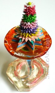 Leo Jean's Starlike© paper sculpture mounted in resin on glass base