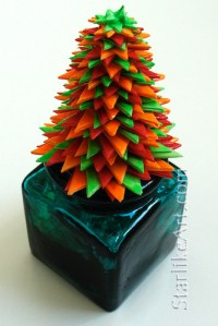 Leo Jean's Starlike© paper sculpture atop aqua inkwell