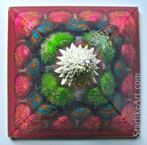 Leo Jean's Starlike© paper sculptures: 24 inside a resin pyramid topped by glowing Starlike©