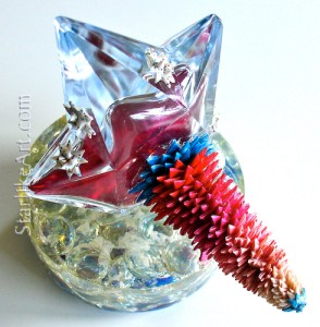 Leo Jean's Starlike© paper sculpture mounted on side of star-shaped glass