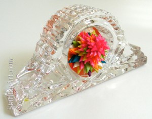 Leo Jean's Starlike© Time paper sculpture mounted on crystal clock face