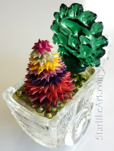 Leo Jean's Starlike© paper sculpture mounted on glass cart with sun face