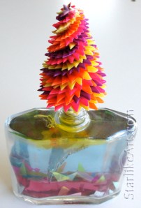 Leo Jean's Starlike© paper sculpture mounted on glass filled with layers of colored resin