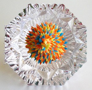 Leo Jean's Starlike© paper sculpture atop cut crystal diamond