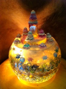 Leo Jean's Starlike© paper sculptures within and on top of semi-sperical resin base