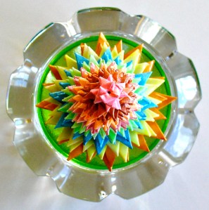 Leo Jean's Starlike© paper sculpture atop crystal.