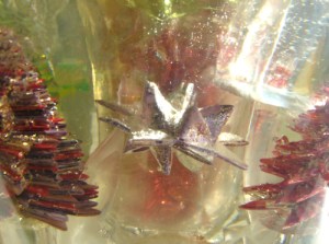 Leo Jean's Starlike© paper sculptures embedded in clear resin.